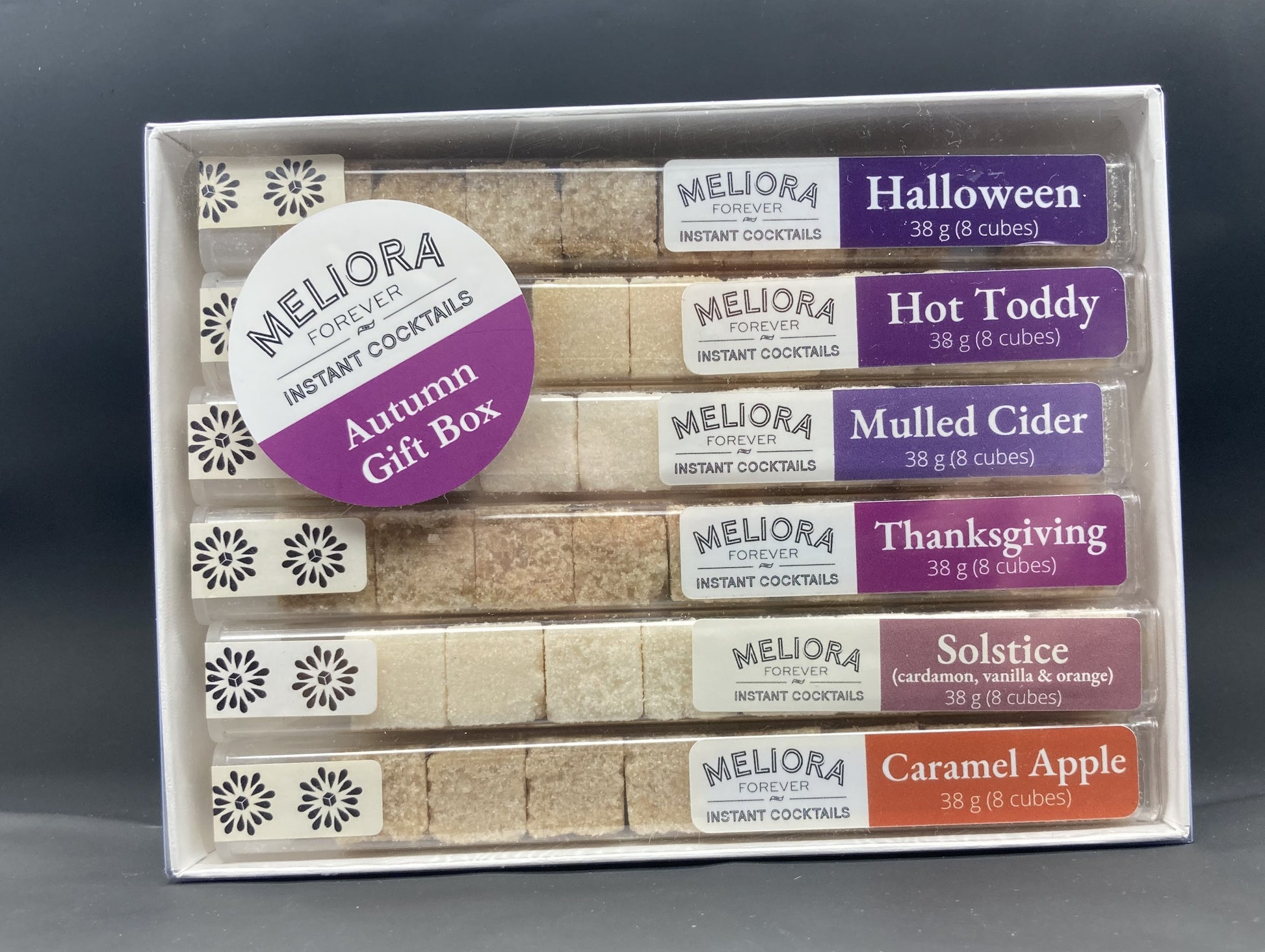 instant cocktail cubes, including 6 different flavors. Sugar cubes infused with bitters, fruits, and natural flavors. Each flavor is packaged in an 8-count tube. Flavors include Halloween (Pumpkin, Caramel, Maple), Thanksgiving (Cranberry, Orange, Cinnamon, Hint of Sage), Hot Toddy, Mulled Cider, Solstice and Caramel Apple.