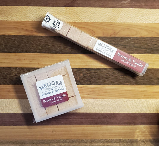 Berries and Vanilla instant cocktail cubes, which are Cane Sugar Cubes infused with bitters, fruits, and natural flavors. There are two packages shown, including an 8-count tube, and a 16-count box.