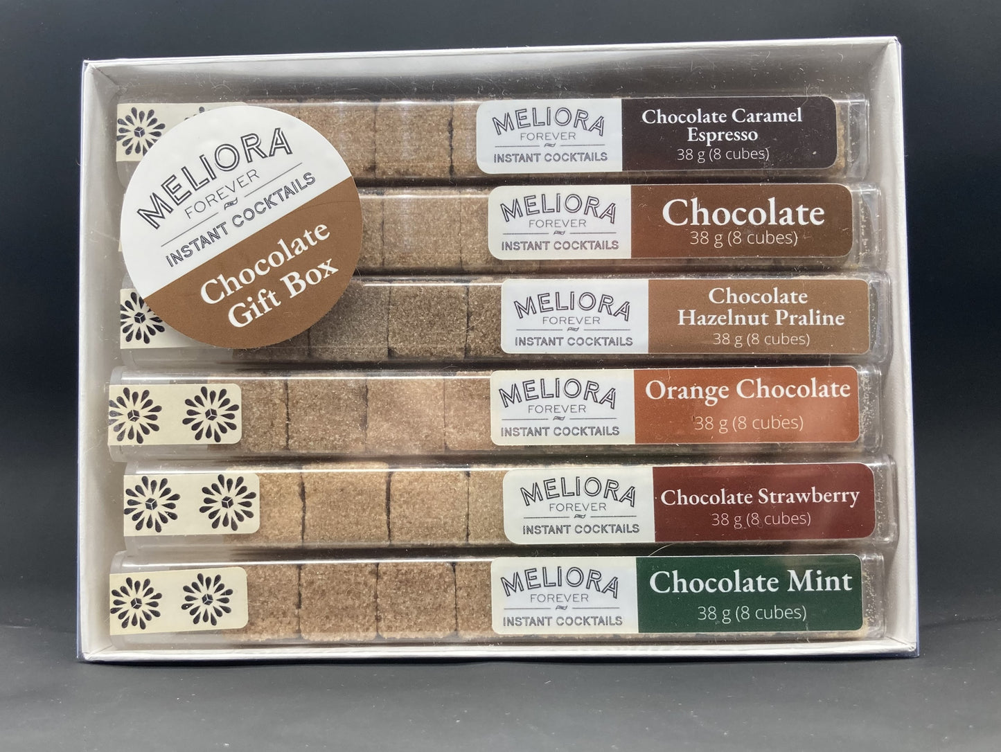 instant cocktail cubes, including 6 different flavors. Sugar cubes infused with bitters, fruits, and natural flavors. Each flavor is packaged in an 8-count tube. Flavors include Chocolate Caramel Espresso, Chocolate, Chocolate Hazelnut Praline, Orange Chocolate, Chocolate Strawberry and Chocolate Mint.