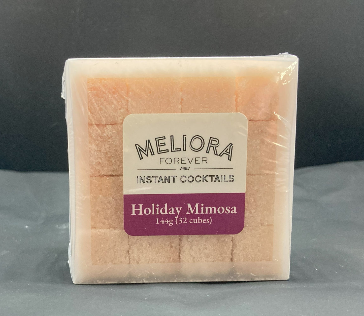 Instant cocktail cube to make a Holiday Mimosa (cranberry & rosemary) Cocktail, which includes  Cane sugar, Bittermens New England Spiced Cranberry bitters, cranberry artisan flavor, rosemary extract, cranberry extract, cranberry powder. 32 Count Box.