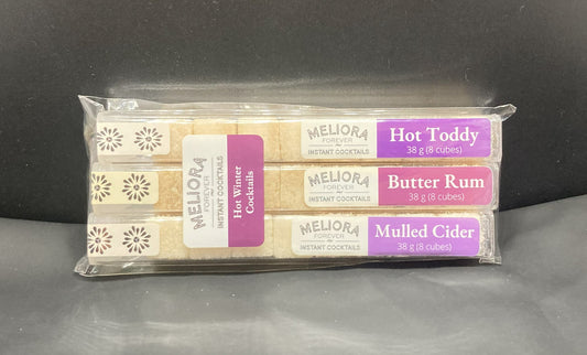Winter Treat instant cocktail cubes, including 3 different flavors. Sugar cubes infused with bitters, fruits, and natural flavors. Each flavor is packaged in an 8 Count tube. Flavors include Hot Toddy (Ginger, Honey, Lemon), Butter Rum and Mulled Cider (Apple, Cinnamon, Orange, Spices).
