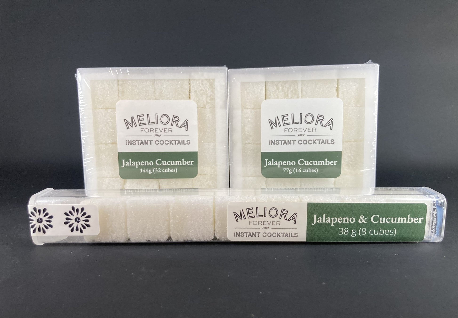 Instant cocktail cube to make a Jalapeno Cucumber Cocktail, which includes Cane sugar, King Floyd's 3.4 fl. oz. green chili bitters, jalapeno extract, cucumber extract, jalapeno powder, cucumber powder. 8 Count Tube, 16 Count Box and 32 Count Box.