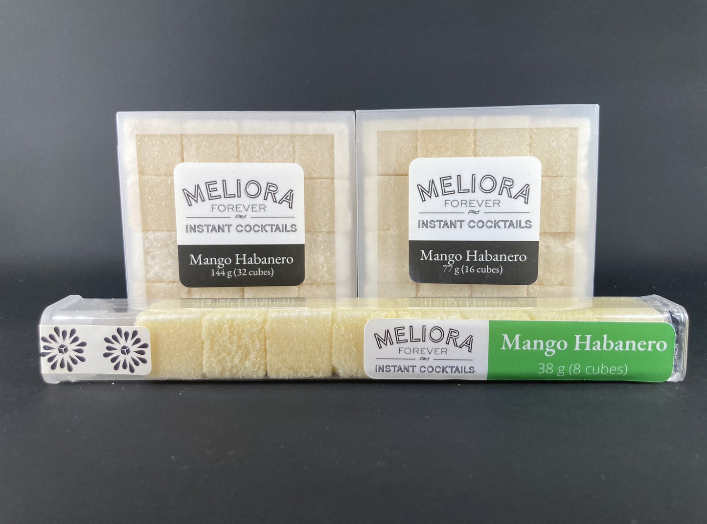 Instant cocktail cube to make a Mango Habanero Cocktail, which includes Cane sugar, Scrappy's Lime bitters, Bittermens Hellfire bitters, Habanero mango concentrate, mango extract, mango powder, Habanero powder. 8ct Tube, 16ct Box and 32ct Box.
