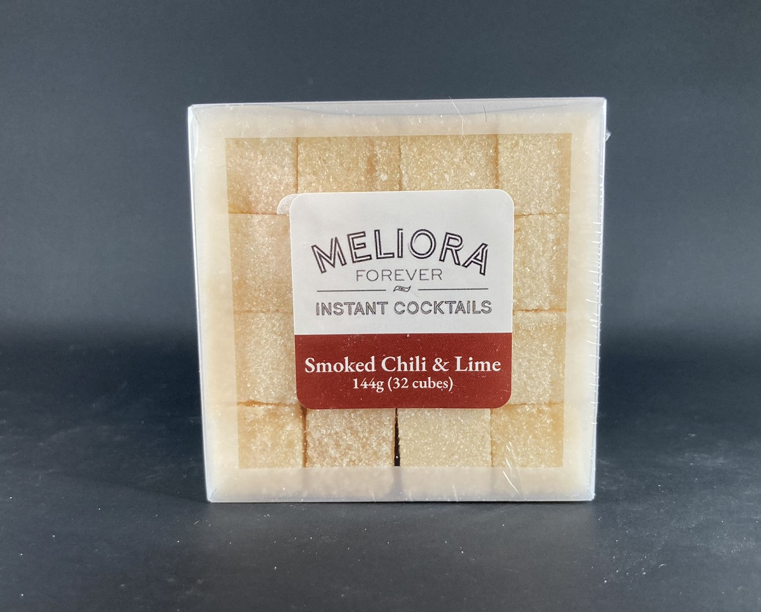 Instant cocktail cube to make a Smoked Chili & Lime Cocktail, which includes Cane sugar, 18.21 Bitters Japanese chili & lime bitters; Hella smoked chili bitters, smoked extract, chili pepper flavor extract, lime oil, lime powder, smoked oak flavor extract. 32 Count Box