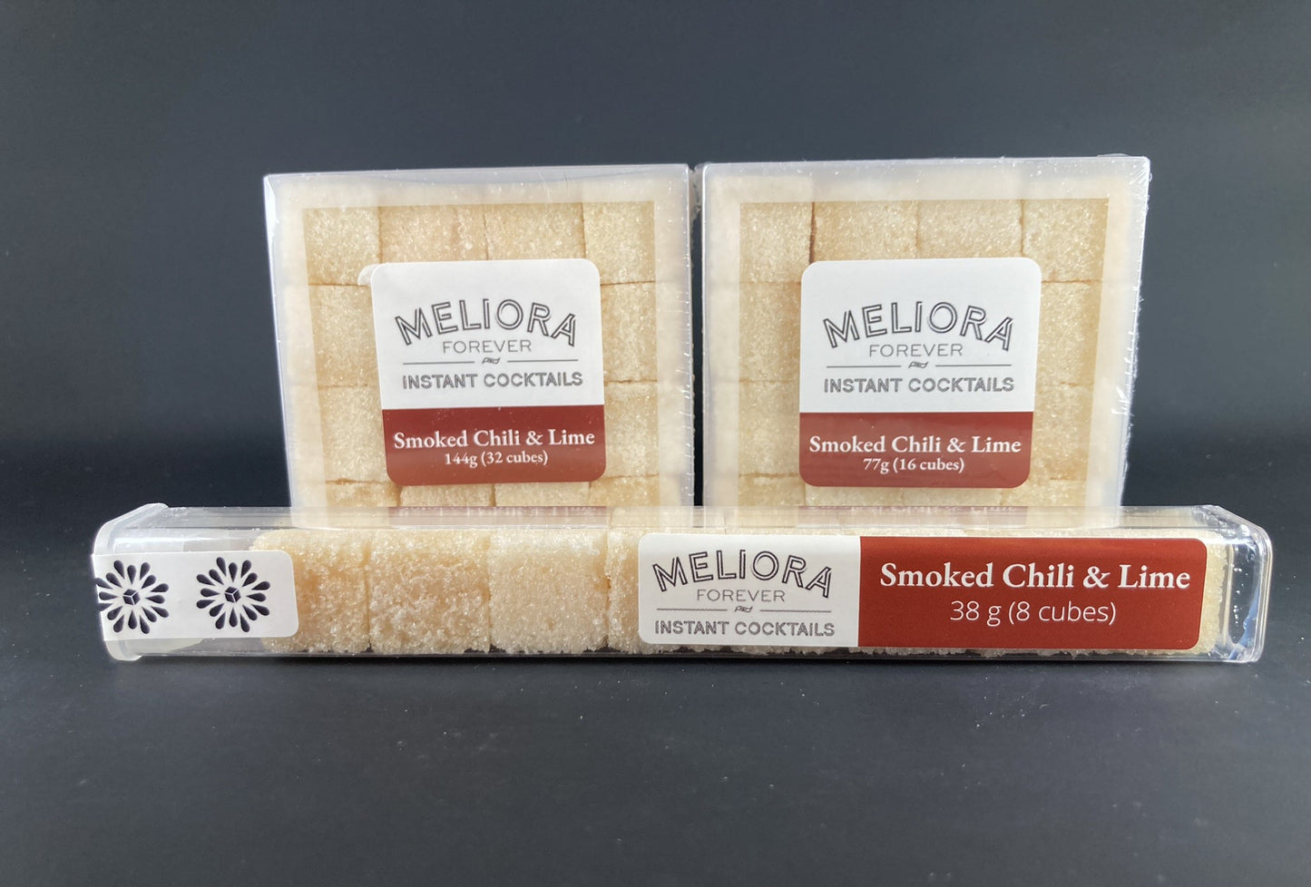 Instant cocktail cube to make a Smoked Chili & Lime Cocktail, which includes Cane sugar, 18.21 Bitters Japanese chili & lime bitters; Hella smoked chili bitters, smoked extract, chili pepper flavor extract, lime oil, lime powder, smoked oak flavor extract. 8 Count Tube, 16 Count Box and 32 Count Box.