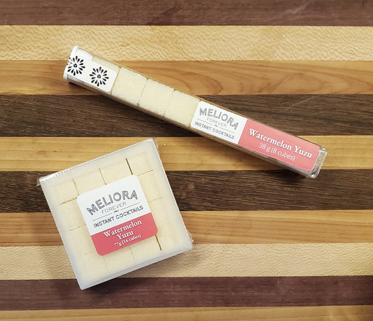 Watermelon Yuzu instant cocktail cubes, which are Cane sugar cubes infused with bitters, fruits, and natural flavors. There are two packages shown, including an 8-count tube, and a 16-count box.