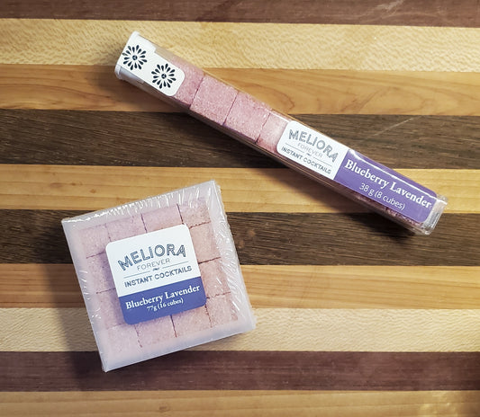Blueberry Lavender instant cocktail cubes, which are Cane Sugar Cubes infused with bitters, fruits, and natural flavors. There are two packages shown, including an 8-count tube, and a 16-count box.