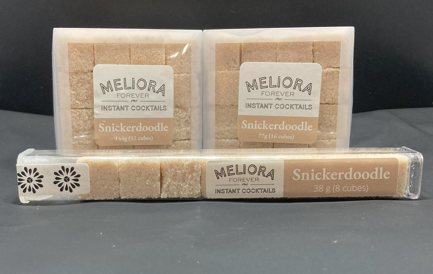 Instant cocktail cube to make a Snickerdoodle (Cinnamon, Vanilla) Cocktail, which includes Cane sugar, Old Forester Smoked Cinnamon bitters, cinnamon extract, ground cinnamon, vanilla extract, vanilla paste. 8 Count Tube, 16 Count Box and 32 Count Box.