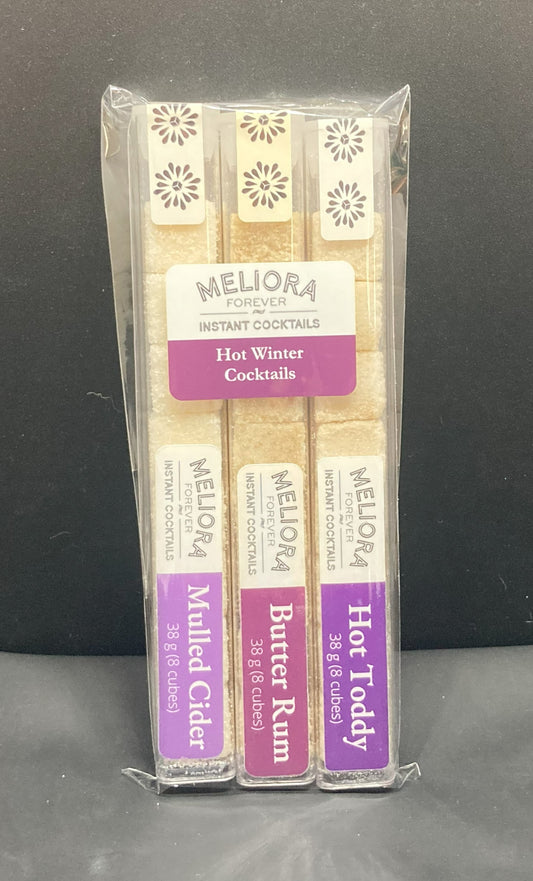 Winter Treat instant cocktail cubes, including 3 different flavors. Sugar cubes infused with bitters, fruits, and natural flavors. Each flavor is packaged in an 8 Count tube. Flavors include Hot Toddy (Ginger, Honey, Lemon), Butter Rum and Mulled Cider (Apple, Cinnamon, Orange, Spices).