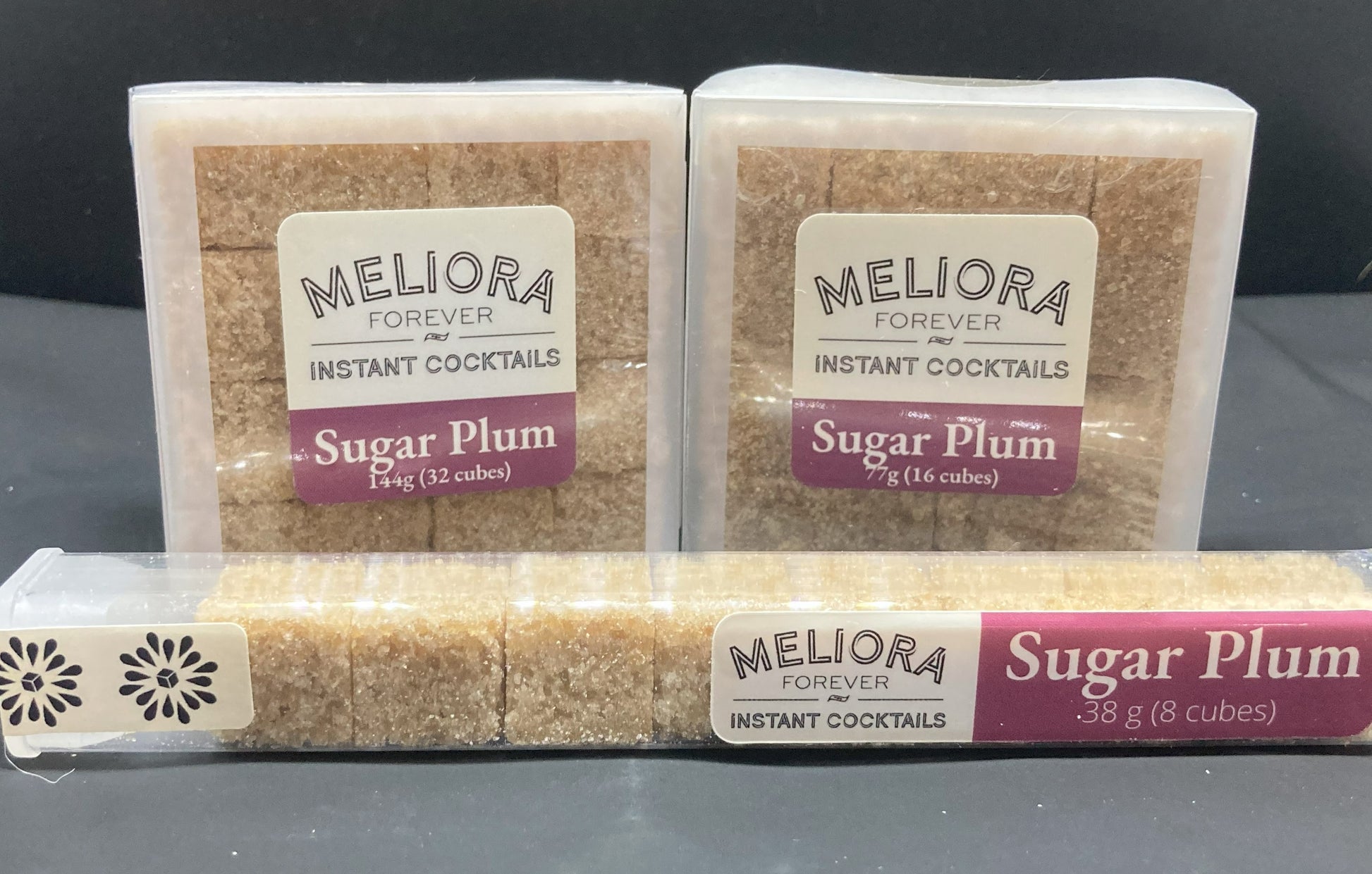 Instant cocktail cube to make a Sugar Plum Cocktail, which includes Demerara sugar, cane sugar, Bittercube blackstrap bitters, plum extract, plum compound, plum powder. 8 Count Tube, 16 Count Box and 32 Count Box. 