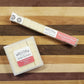 Watermelon Yuzu instant cocktail cubes, which are Cane sugar cubes infused with bitters, fruits, and natural flavors. There are two packages shown, including an 8-count tube, and a 16-count box.